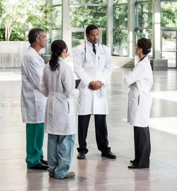 Four Doctors in Discussion, Symbolizing PPO Healthcare